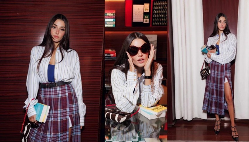 Hande Erçel Valentino defilesinde elindeki kitaplarla dikkat çekti